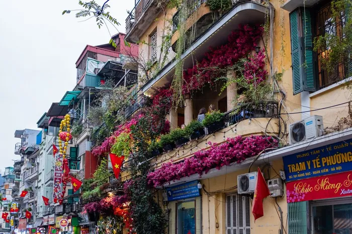 Colorful Old Quarter street in Hanoi with balconies